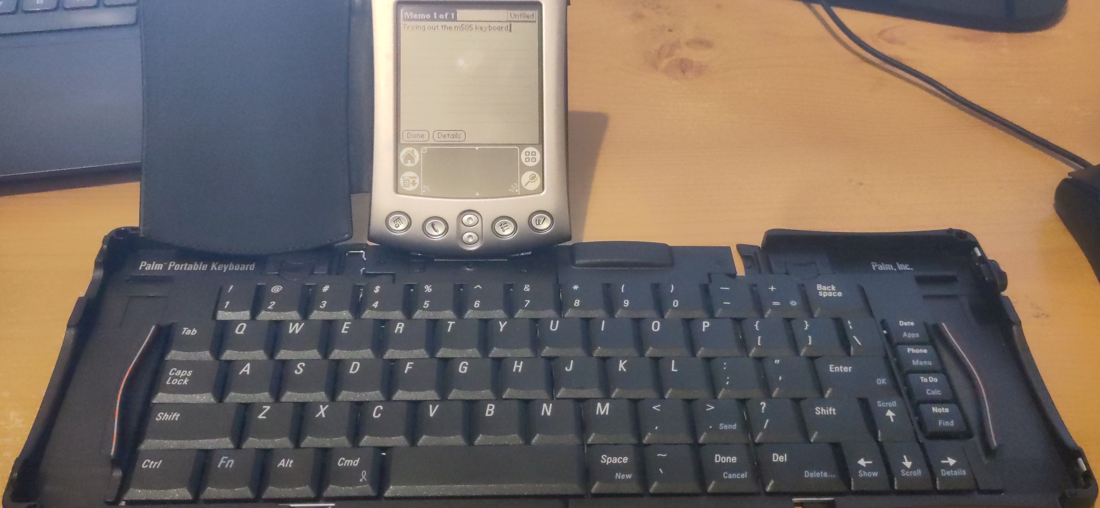 A Palm m505 on a folding keyboard.